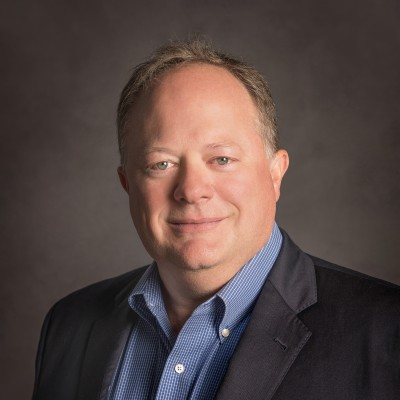 Mark Dean, executive leader in upstream energy operations, professional headshot